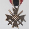 DISTINTIVO MERITI DI GUERRA CON SPADE IN BRONZO